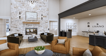 a living room with leather furniture and a stone fireplace
